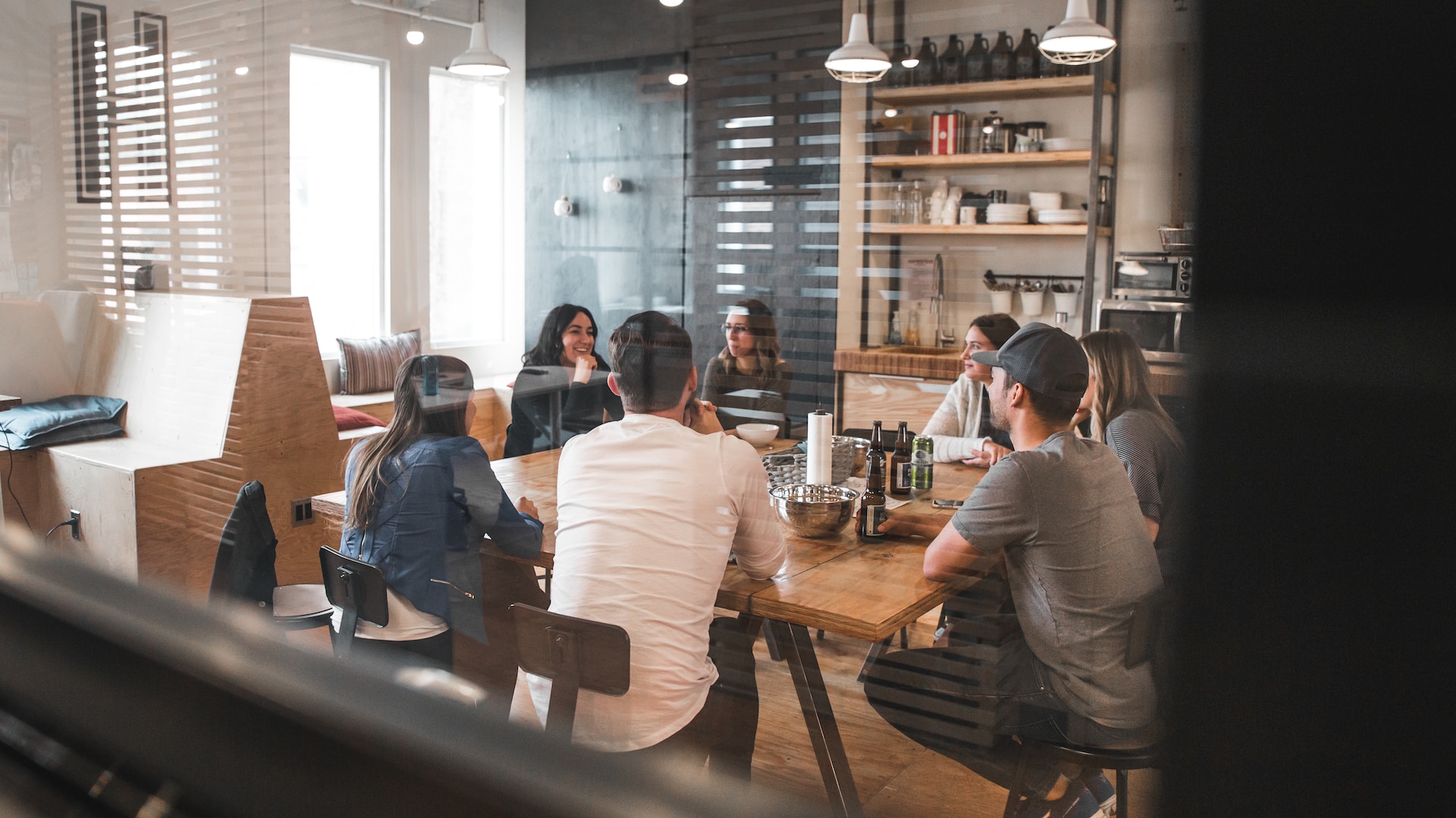 people talking together in a meeting room