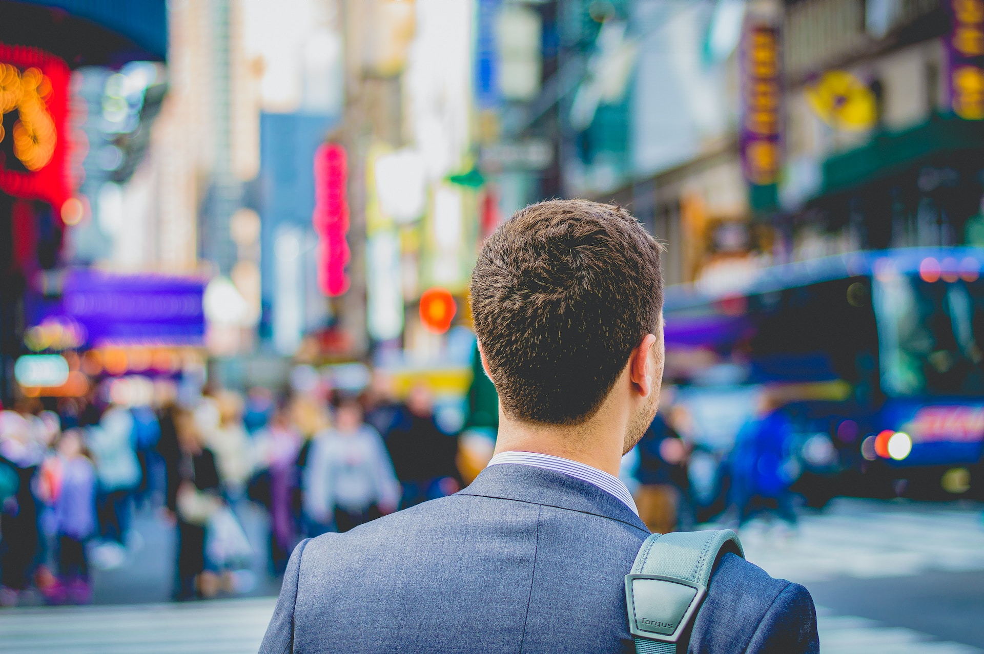 a business man walking in the street going to the office